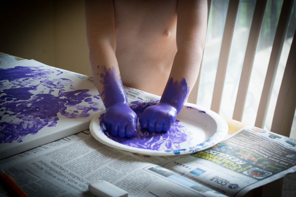 Liam was napping during all of this. He was up again last night from 2 a.m. to 5 a.m. I thought it was teeth again or that he was getting into a bad habit, enjoying this night time attention from mom and dad, but now I think he may have a cold of some sorts, too. Anyway, Emma takes her painting VERY seriously.
