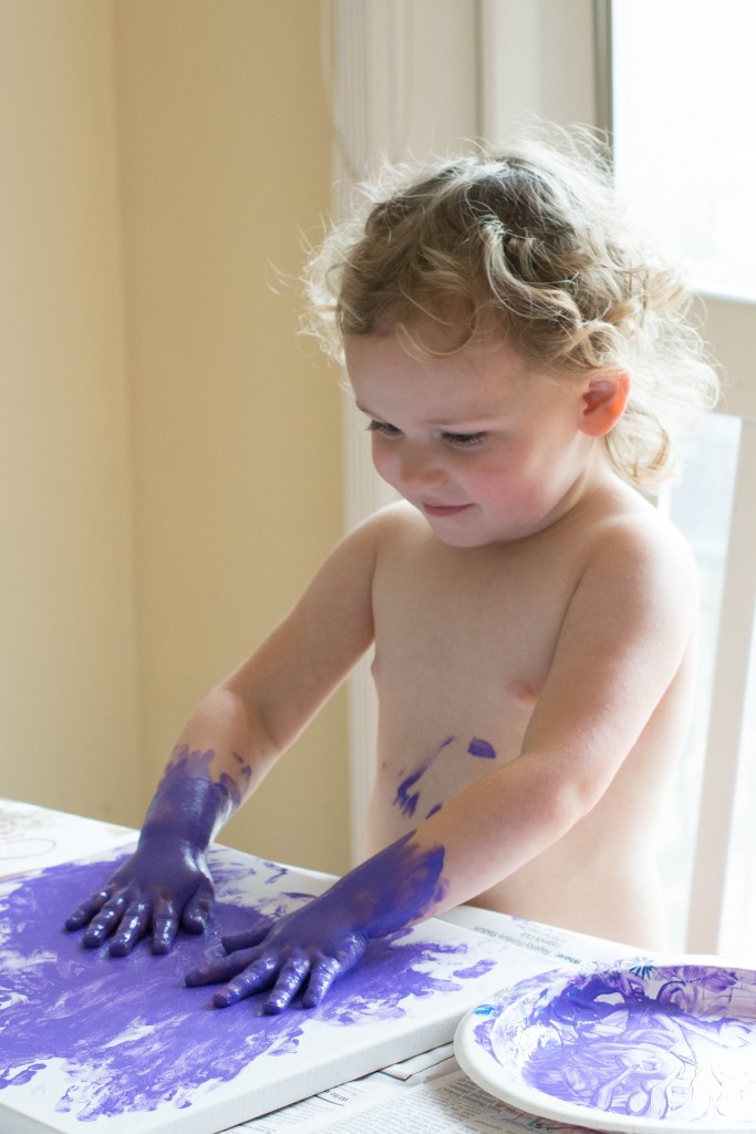 I was a bit sad that she decided to make a big purple blob on this canvas. She had such cool handprints everywhere. Now, they are only on the outside. We'll add more color to it tomorrow.