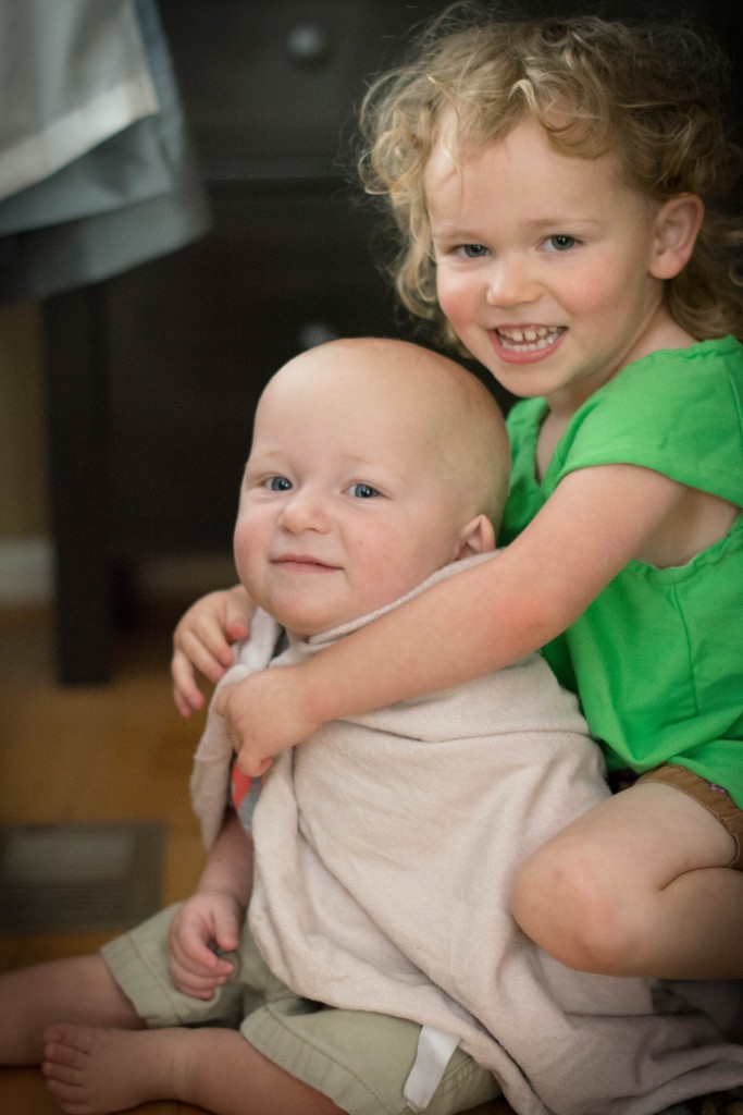 A few things about this. It is the first time I have seen Emma play dress up with Liam. Poor boy should probably get used to it. Here, he's wearing her bunny as cape. He's lucky she's into superheroes and not Barbies. In this picture, Liam looks SOO much like my sister Colleen when we were younger. There's a picture of us at about these ages, and she is making the exact same face.