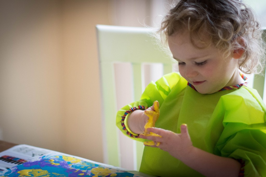 Finishing up daddy's art for his new office with some yellow paint