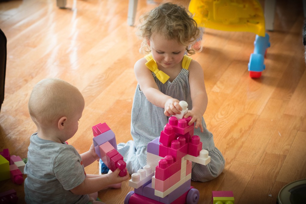 I am trying hard to vary toys, so I pulled out the legos. It is so much fun to see these two play together!